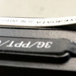 Bent Aluminum Label, Removed Incorrectly from Liner